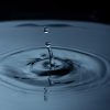 water droplets creating ripple liquid